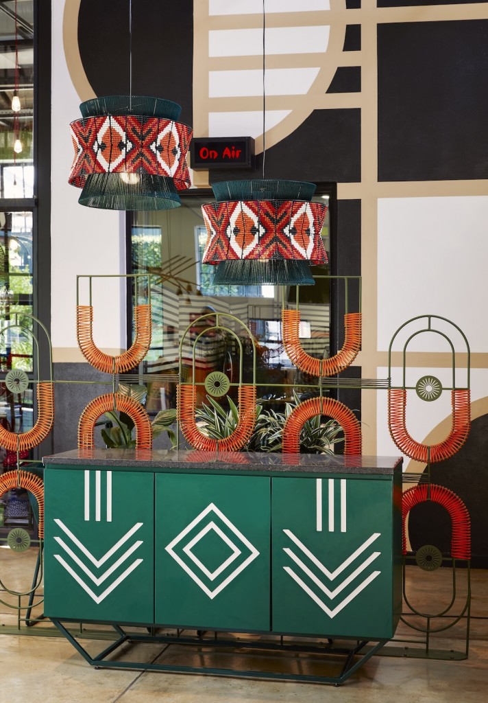 Steel woven screen by TheUrbanative behind server by Sifiso Shange (Afri Modern) at Nando’s Central Kitchen, Johannesburg. Photographed by Elsa Young. 